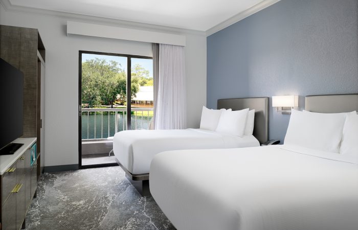 Two double beds looking out over the water